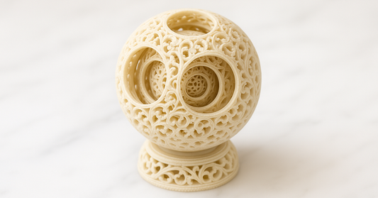 A carved Chinese puzzle ball with nested spheres visible through the openwork