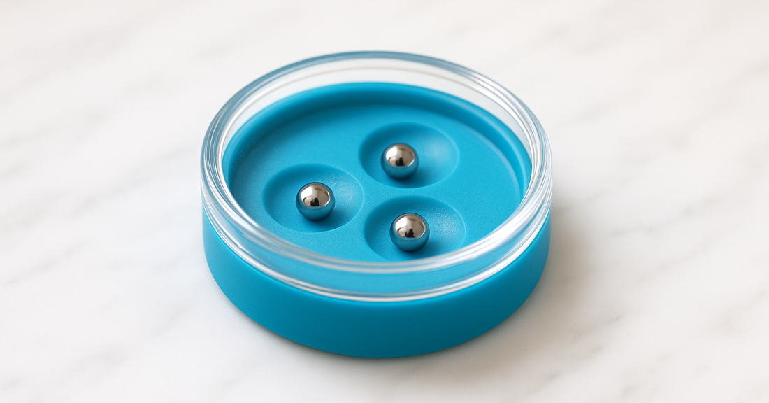 A dexterity puzzle: ball bearings in dished depressions under glass