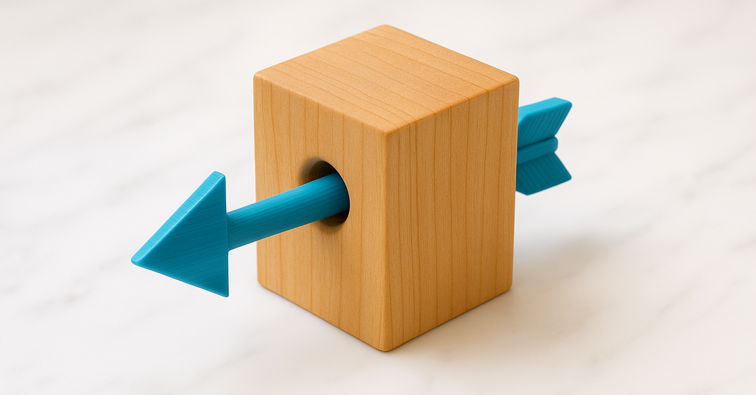 An impossible object: an arrow through a block, too wide to have passed