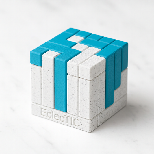 EclecTIC mechanical puzzle on white marble surface