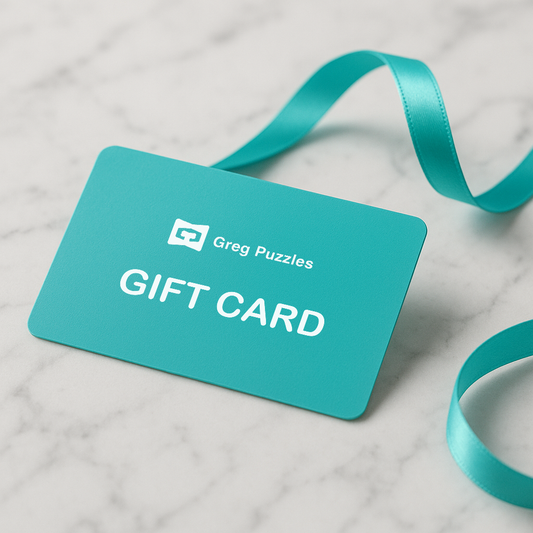 Greg Puzzles gift card in turquoise on white marble with satin ribbon