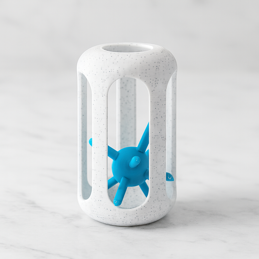 Hedgehog in a Cage mechanical puzzle on white marble surface