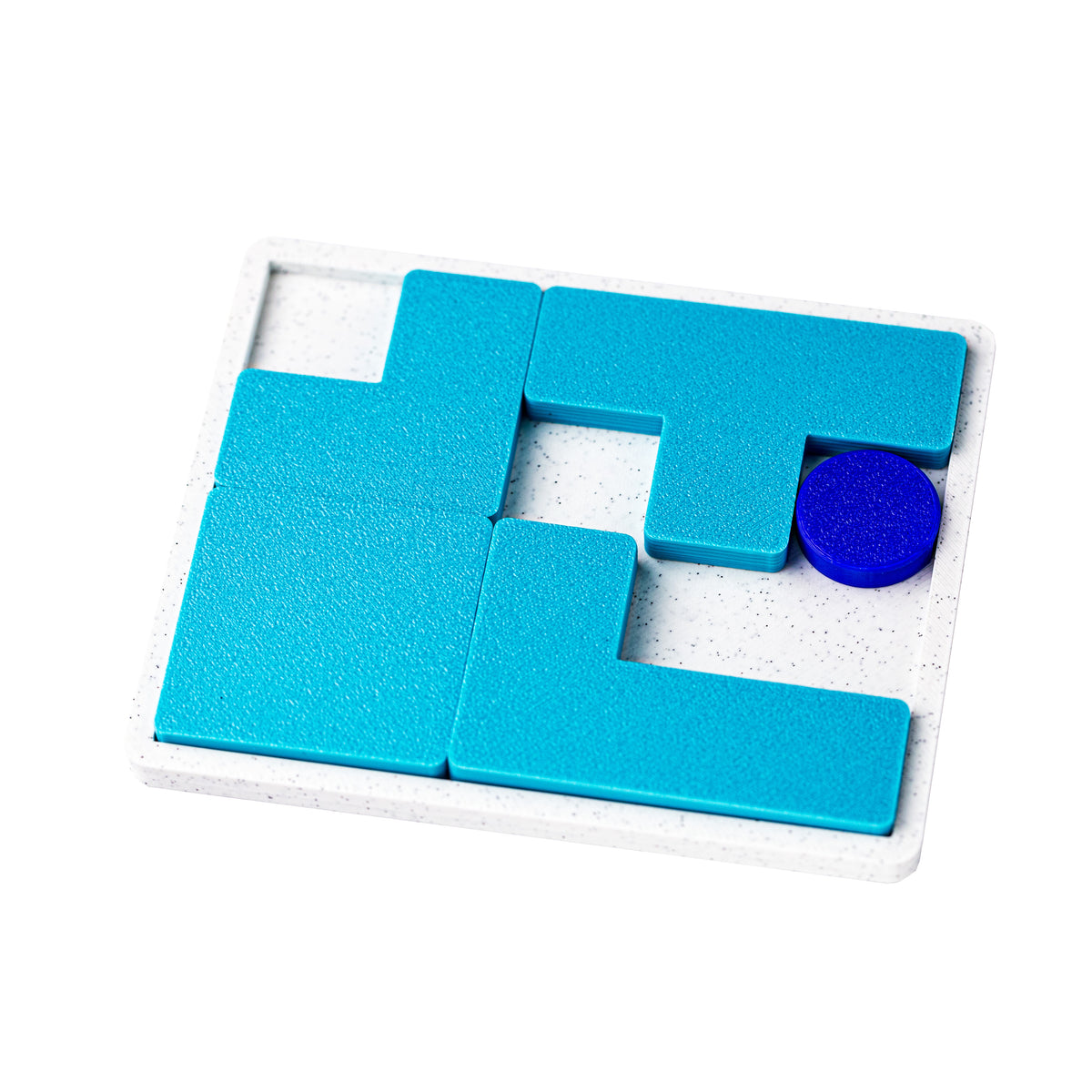 One Way or Another puzzle at an angle, blue disc resting in a corner of the tray