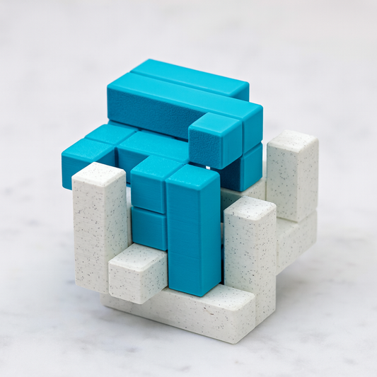 PoeTIC mechanical puzzle on white marble surface