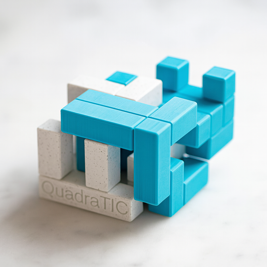 QuadraTIC mechanical puzzle on white marble surface