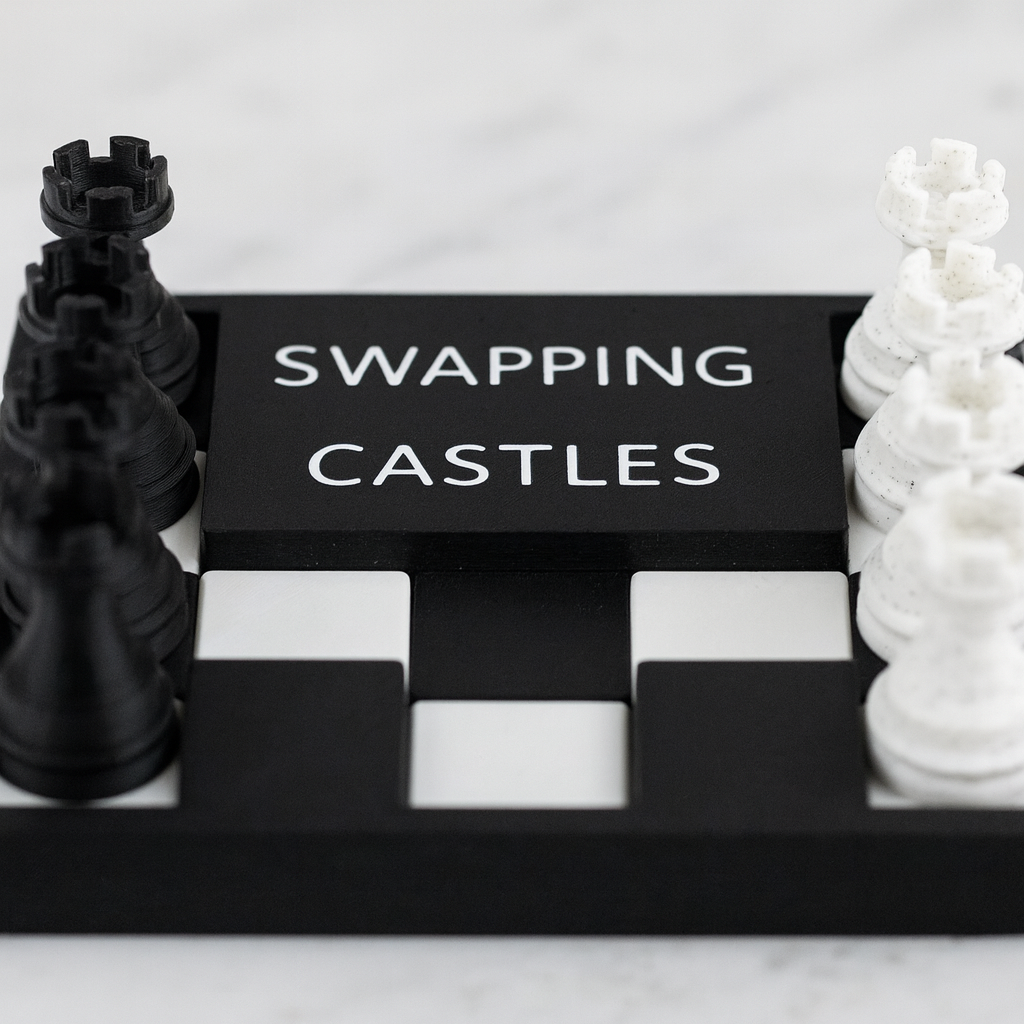 Swapping Castles mechanical puzzle on white marble surface