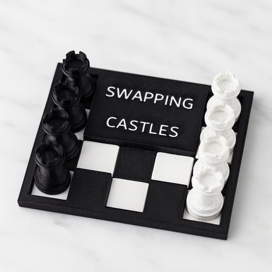 Swapping Castles mechanical puzzle on white marble surface