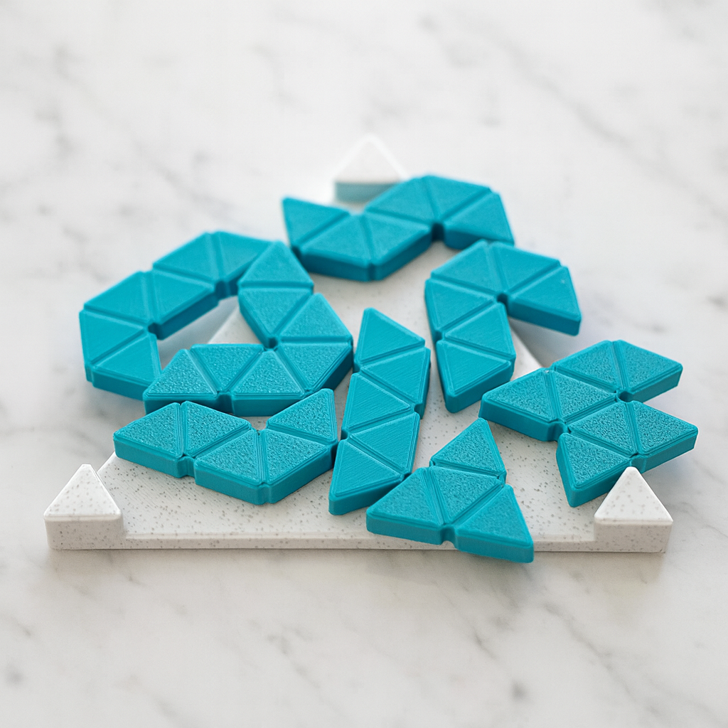 Trimini Frame mechanical puzzle on white marble surface