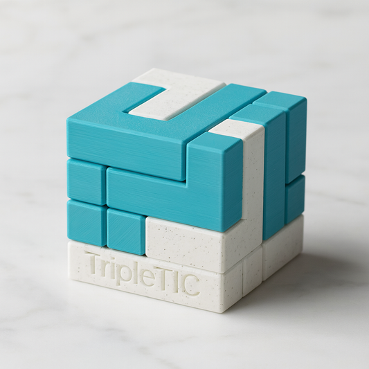 TripleTIC Puzzle mechanical puzzle on white marble surface