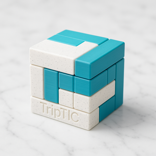 TripTIC Puzzle mechanical puzzle on white marble surface
